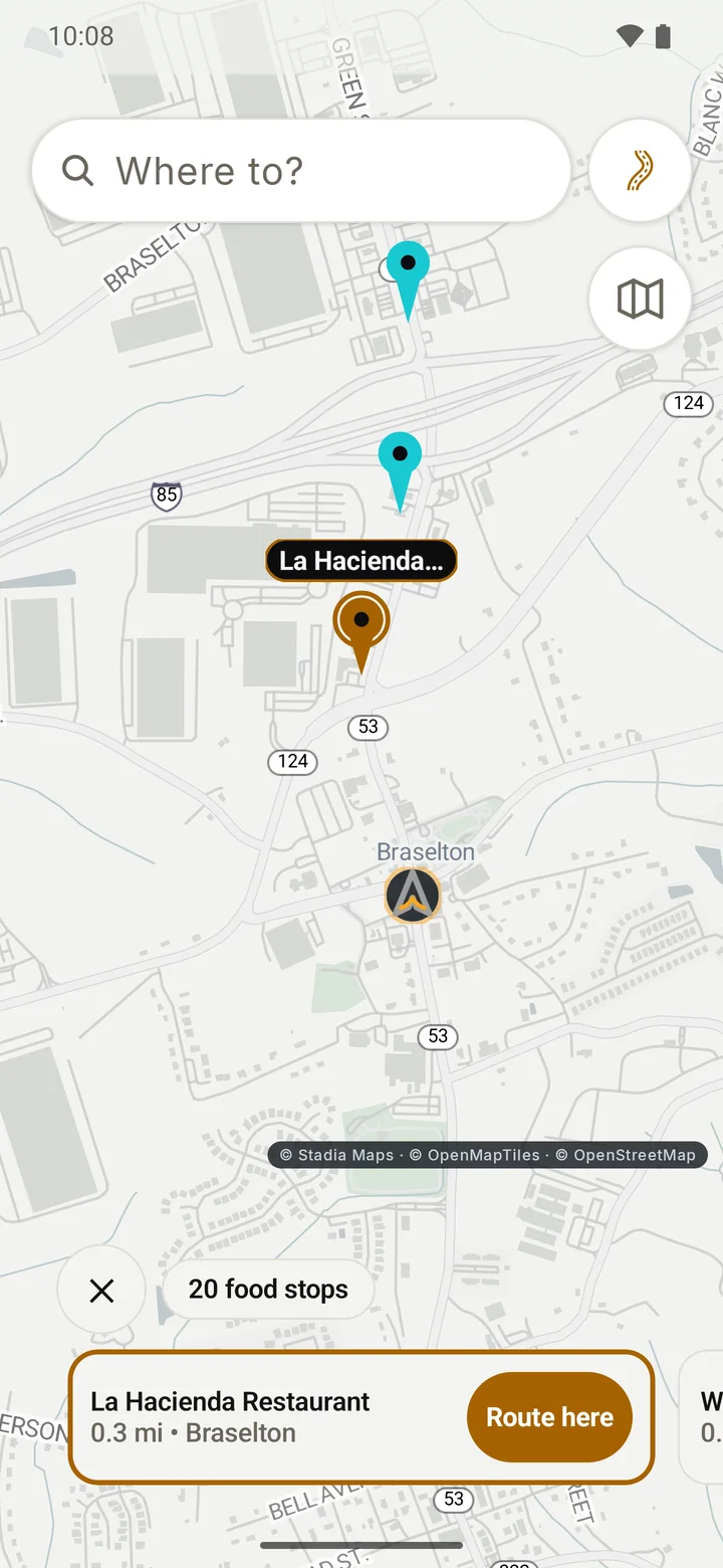 RIDE map after tapping Food: food places near the rider as pins, a count chip, a Close button, and a card for one restaurant with its distance and a Route here button.